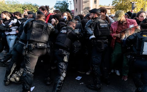 epa13284473 French riot police intervene at the entrance of the 'Helene Boucher' high school as students demonstrate outside as part of a national day of protest in Paris, France, 06 October 2026.  EPA/GAUTHIER BEDRIGNANS